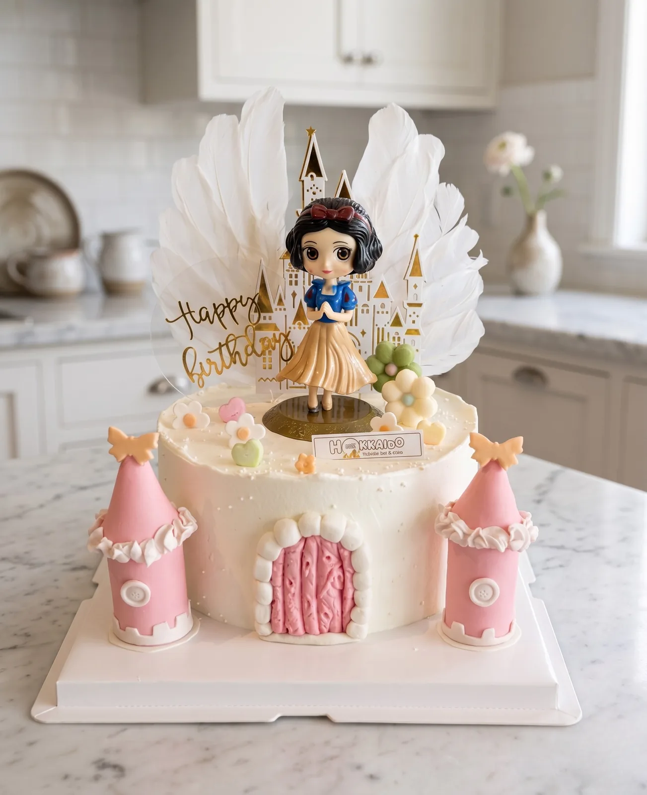 Snow White princess castle cake with feather topper and pink fondant towers